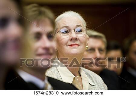 Business people attending meeting in an office View Large Photo Image Stock Image - Business people attending meeting in an office. Fotosearch