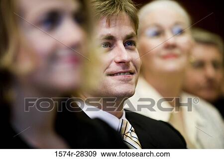 Business people attending meeting in an office View Large Photo Image Stock Photo - Business people attending meeting in an office. Fotosearch
