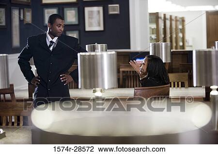 Business People conversing in an office View Large Photo Image Stock Image - Business People conversing in an office. Fotosearch