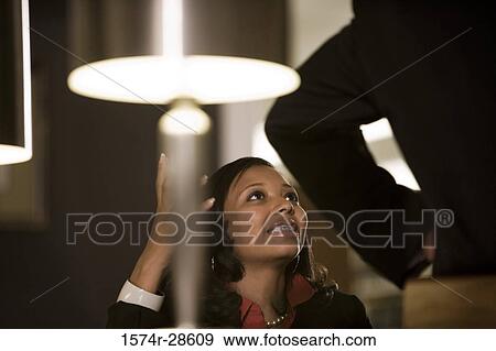 Business People conversing in an office View Large Photo Image Stock Photo - Business People conversing in an office. Fotosearch