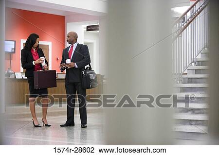 Business People conversing to each other View Large Photo Image Stock Image - Business People conversing to each other. Fotosearch
