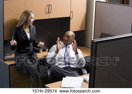 Picture - Business people discussing in an office. Fotosearch