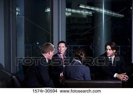 Picture - Business people discussing in an office. Fotosearch