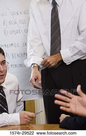 Business people discussing in an office View Large Photo Image Stock Image - Business people discussing in an office. Fotosearch