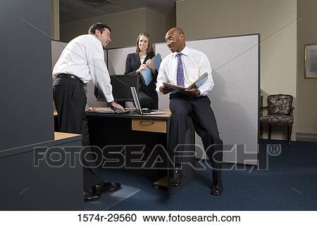 Business people discussing in an office View Large Photo Image Stock Image - Business people discussing in an office. Fotosearch