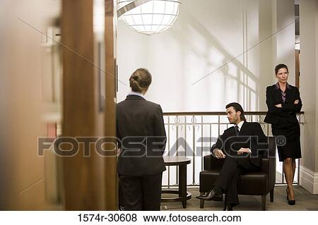 Business people discussing in an office View Large Photo Image Stock Photo - Business people discussing in an office. Fotosearch