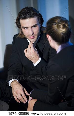 Business people discussing in an office View Large Photo Image Stock Photograph - Business people discussing in an office. Fotosearch
