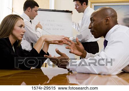 Business people discussing in an office View Large Photo Image Stock Photography - Business people discussing in an office. Fotosearch