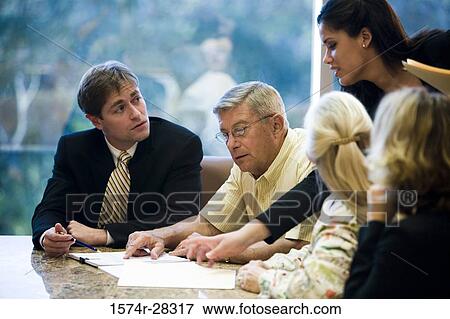 Business people discussing in conference room View Large Photo Image Stock Photo - Business people discussing in conference room. Fotosearch