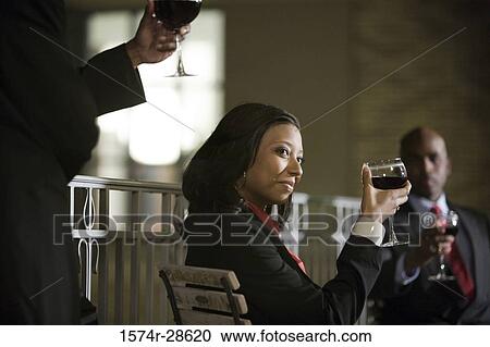 Business People holding wineglasses View Large Photo Image Stock Image - Business People holding wineglasses. Fotosearch