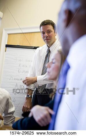 Business people in an office View Large Photo Image Stock Photography - Business people in an office. Fotosearch
