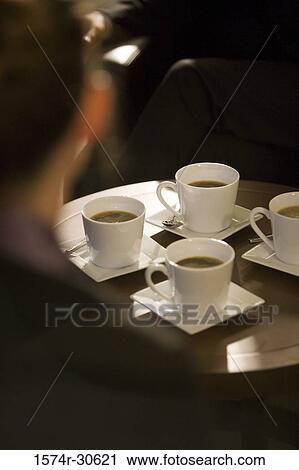 Business people sitting by table View Large Photo Image Stock Image - Business people sitting by table. Fotosearch