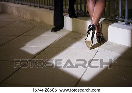 Stock Photography - Business People standing by railing. Fotosearch