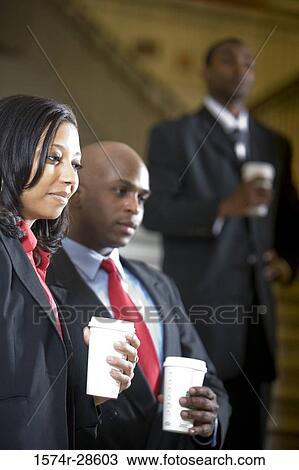 Business People standing on staircase in an office View Large Photo Image Stock Image - Business People standing on staircase in an office. Fotosearch