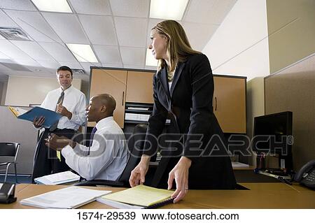 Business people working in an office View Large Photo Image Stock Photo - Business people working in an office. Fotosearch