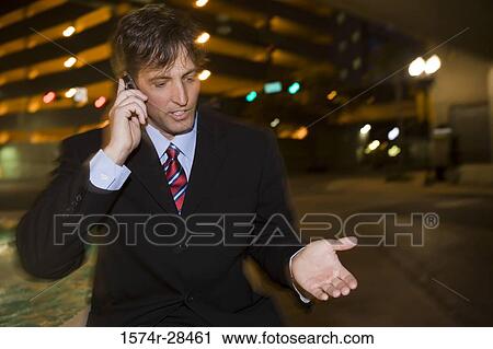 Businessman communicating on the mobile phone View Large Photo Image Stock Image - Businessman communicating on the mobile phone. Fotosearch