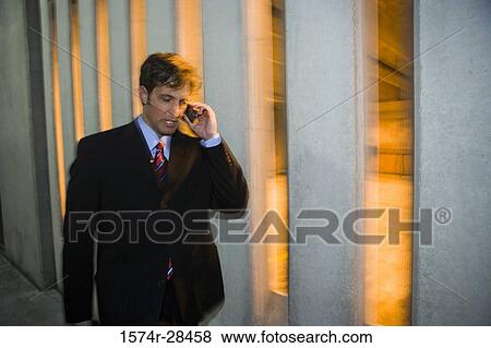 Businessman communicating on the mobile phone View Large Photo Image Stock Photo - Businessman communicating on the mobile phone. Fotosearch
