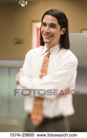 Stock Image - Businessman smiling and looking away. Fotosearch