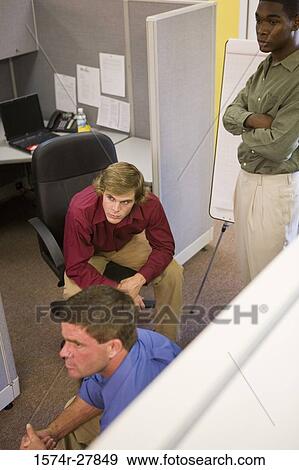 Businessmen by a chart board in an office View Large Photo Image Stock Photo - Businessmen by a chart board in an office. Fotosearch