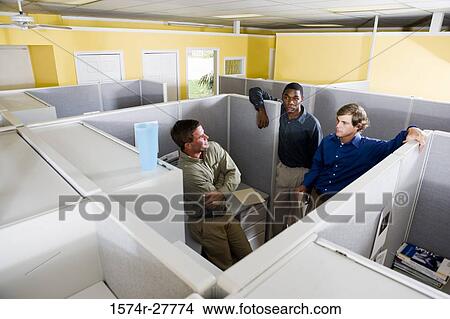 Picture - Businessmen conversing in an office. Fotosearch