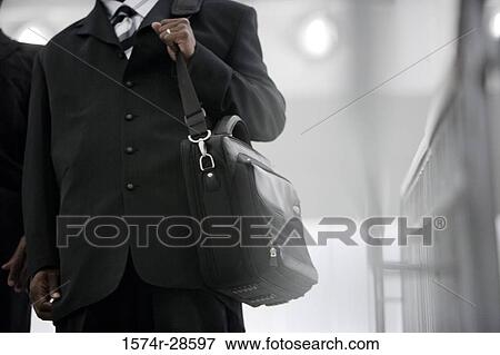 Stock Photo - Businessmen in an office. Fotosearch