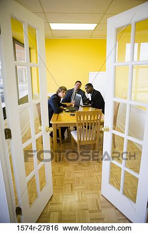 Businessmen in full suit looking at door in an office View Large Photo Image Stock Photograph - Businessmen in full suit looking at door in an office. Fotosearch