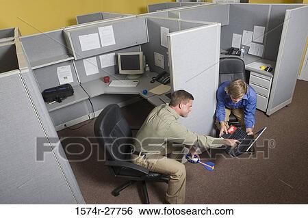 Stock Photograph - Businessmen looking at a laptop. Fotosearch