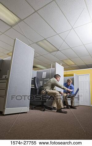 Businessmen looking at a laptop View Large Photo Image Stock Photography - Businessmen looking at a laptop. Fotosearch