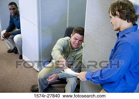 Businessmen looking in a file View Large Photo Image Stock Image - Businessmen looking in a file. Fotosearch