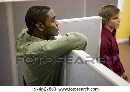 Stock Image - Businessmen looking in the cabin. Fotosearch