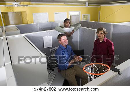 Businessmen looking to net in an office View Large Photo Image Stock Image - Businessmen looking to net in an office. Fotosearch