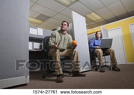 Businessmen sitting with laptop in an office View Large Photo Image Stock Image - Businessmen sitting with laptop in an office. Fotosearch