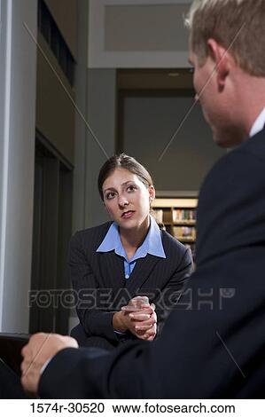 Businesswoman looking businessman in an office View Large Photo Image Stock Image - Businesswoman looking businessman in an office. Fotosearch