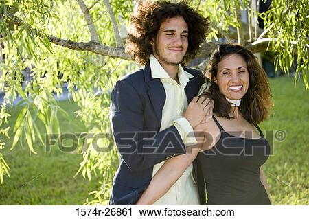 Stock Image - Cheerful mature woman and a young woman standing together. Fotosearch