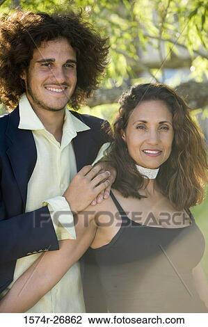 Cheerful mature woman and a young woman standing together View Large Photo Image Stock Image - Cheerful mature woman and a young woman standing together. Fotosearch
