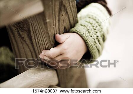 Child hiding by wooden staircase View Large Photo Image Stock Photo - Child hiding by wooden staircase. Fotosearch