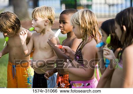 Children eating flavored ice View Large Photo Image Stock Photograph - Children eating flavored ice. Fotosearch