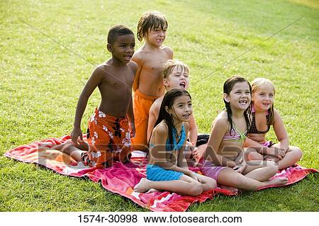 Children sitting on a towel View Large Photo Image Stock Photo - Children sitting on a towel. Fotosearch