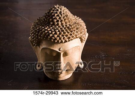 Close-up of a Buddha statue kept on the table View Large Photo Image Stock Image - Close-up of a Buddha statue kept on the table. Fotosearch