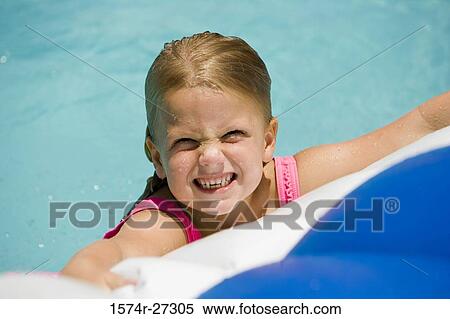 Close-up of a cheerful girl at swimming pool View Large Photo Image Stock Photography - Close-up of a cheerful girl at swimming pool. Fotosearch