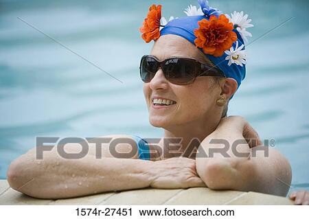 Close-up of a cheerful senior woman in a swimming pool View Large Photo Image Stock Image - Close-up of a cheerful senior woman in a swimming pool. Fotosearch