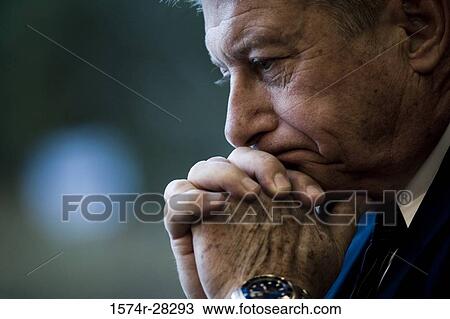 Close-up of a contemplative businessman with hand on chin View Large Photo Image Stock Image - Close-up of a contemplative businessman with hand on chin. Fotosearch