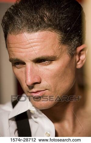 Close-up of a contemplative mid adult man View Large Photo Image Stock Image - Close-up of a contemplative mid adult man. Fotosearch