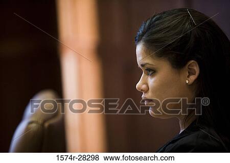 Close-up of a contemplative businesswoman in an office View Large Photo Image Stock Photo - Close-up of a contemplative businesswoman in an office. Fotosearch