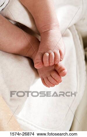Picture - Close-up of a leg of a newborn baby. Fotosearch