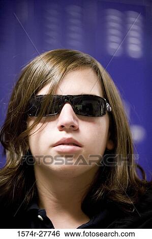 Close-up of a male student wearing sunglasses View Large Photo Image Stock Photograph - Close-up of a male student wearing sunglasses. Fotosearch