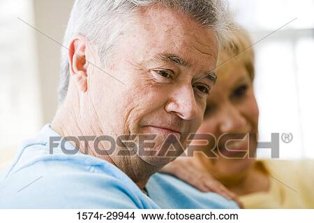 Picture - Close-up of a mature couple smiling. Fotosearch