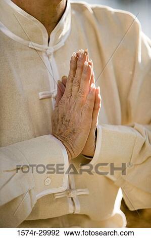 Close-up of a mature woman meditating in praying position View Large Photo Image Stock Image - Close-up of a mature woman meditating in praying position. Fotosearch