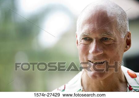 Close-up of a senior man smiling View Large Photo Image Stock Photo - Close-up of a senior man smiling. Fotosearch