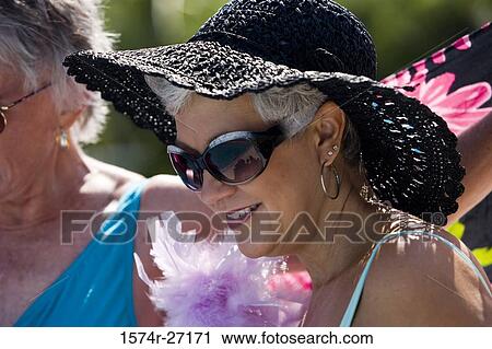 Close-up of a smiling senior woman with fur and hat View Large Photo Image Stock Image - Close-up of a smiling senior woman with fur and hat. Fotosearch